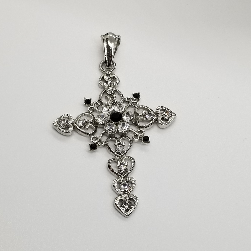 silver tone cross pendant with black and clear rhinestones